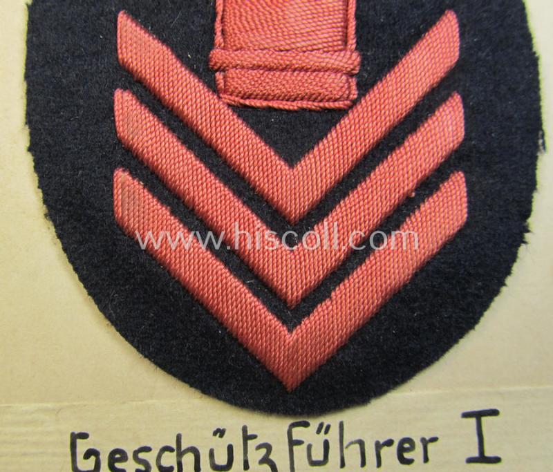Unusual example of a neatly hand-embroidered WH (Kriegsmarine) trade- ie. special-career-patch (ie. 'Tätigkeitsabzeichen') as was intended for a: 'Geschützführer I' (and that comes as period-attached on a carton 'card')