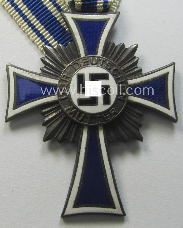 'Ehrenkreuz der deutschen Mutter - zweite Stufe' (or: silver-class mothers'-cross) that came mounted onto its long-sized ribbon as issued and recently found