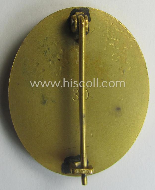 'Verwundeten-Abzeichen in Gold' being a maker- (ie. '30'-) marked- and typical 'Buntmetall'-based example that comes stored in period etui as issued