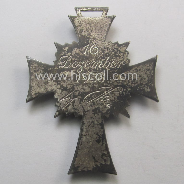 'Ehrenkreuz der deutschen Mutter - zweite Stufe' (or: silver-class mothers'-cross) that came together with its 'rolled-up' ribbon as issued and recently found