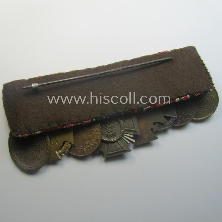 Unusually seen, 8-pieced WWI- (ie. TR- ie. N.S.D.A.P.-) related 'Ordenspange' showing amongst others: an 'N.S.D.A.P-D.A. in Bronze' (ie. '3. Stf. für 10 Jahre t.D.') and various WWI-period Austrian-(Hungarian) awards