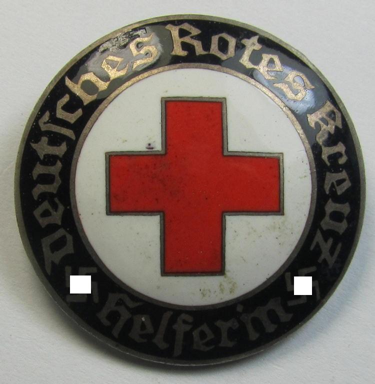 Attractive example of a DRK (ie. 'Deutsches Rotes Kreuz' or German Red Cross) nurses'-badge as was intended for a: 'Helferin' being a non-maker-marked example (showing a: 'Ges.Gesch.'-designation) that comes in a fully untouched condition