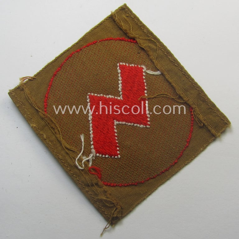 Moderately used, DJ (ie. 'Deutsches Jungvolk') arm-badge as was specifically intended for usage by a member who served within the: 'Oberbann 1' (being a tunic-removed example that misses its 'RzM'-etiket)