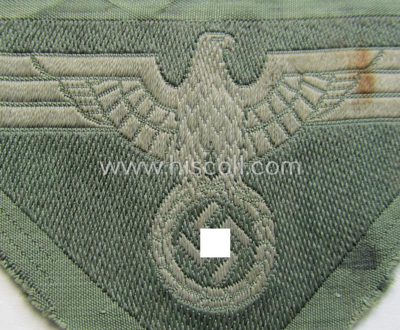 Later-war-period WH (Heeres) so-called: 'M44'-pattern- and/or: trapezoid-shaped breasteagle ie. 'Brustadler für Mannschaften u. Uffz.' (being a field-grey-coloured example that is void of an interwoven 'BeVo-Wuppertal'-makers'-designation)