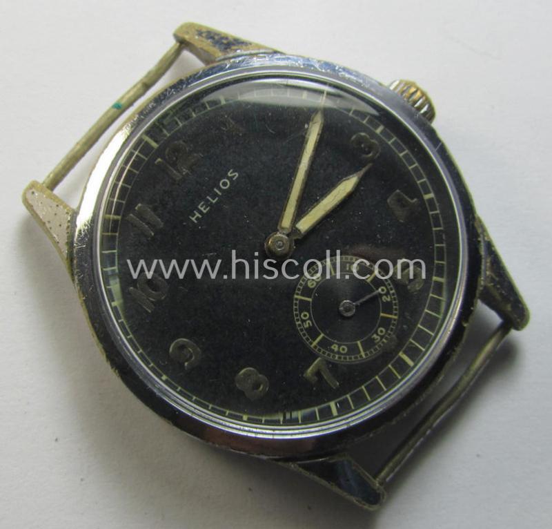 Neat - and scarcely encountered! - WH (Heeres, LW etc.) WWII-period wrist-watch (or: 'Dienstuhr') of the make: 'Helios' having an engraved number: 'D26525H' on its back (and that comes in a non-running condition)