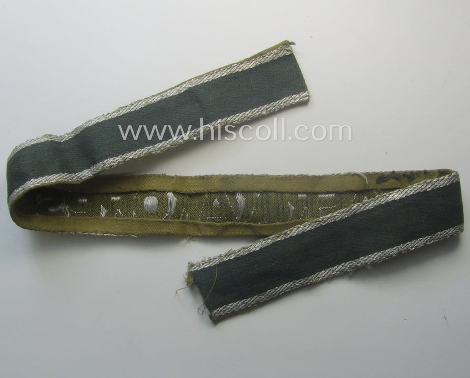 Truly worn, 'BeVo'-like cuff-title (ie. 'Ärmelstreifen') entitled: 'Afrikakorps' being a with certainty issued example that comes in an overall very nice- (ie. non-shortened- and/or once tunic-attached-), condition