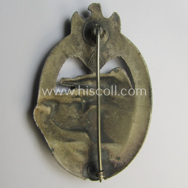 'Panzerkampfabzeichen in Silber' (or: silver-class panzer-assault badge or PAB) being a clearly maker- (ie. 'AS' in a triangle-) marked- and/or typical zinc- (ie. 'Feinzink'-) based specimen as was procuced by a to date unknown maker