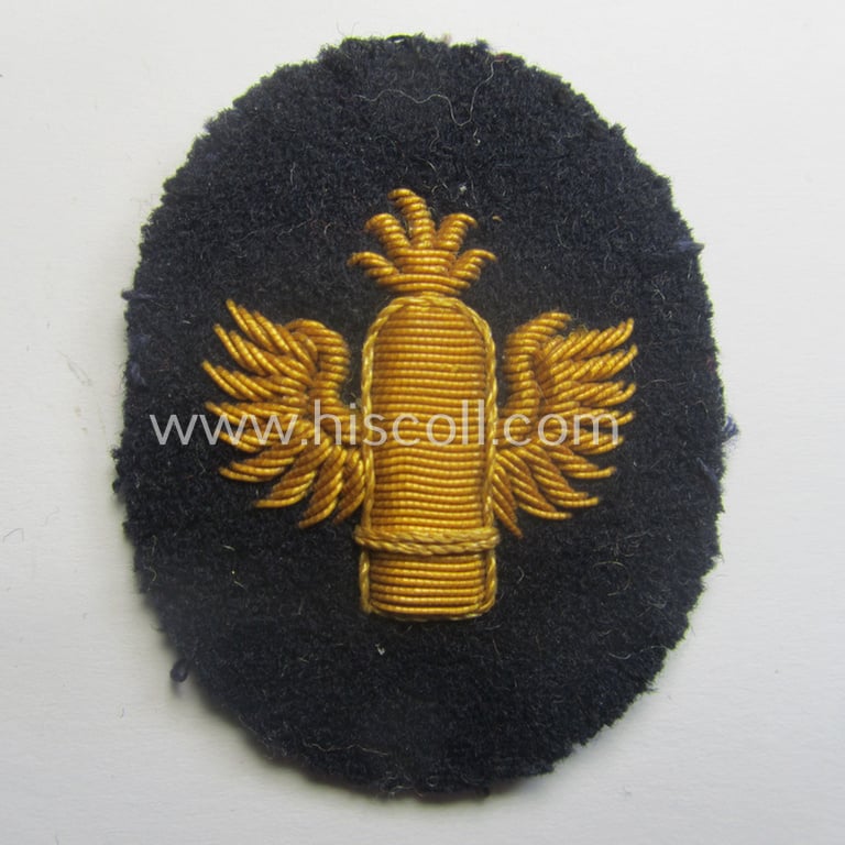 Fully matching set ie. pair of WH (Kriegsmarine) hand-embroidered career- ie. specialist-armbadges, as executed on dark-blue-coloured wool as intended for usage by an officer serving within a: 'Küstenartillerie'-unit