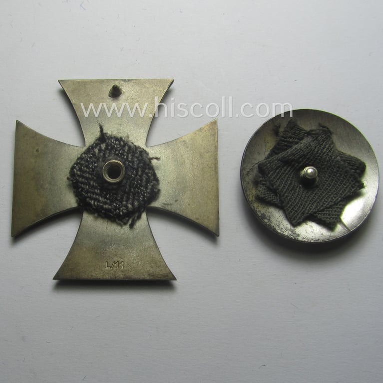 Stunning, 'EK 1. Klasse' (or: Iron Cross 1st class) as executed in the scarcely seen so-called: 'screw-back'-pattern being a maker- (ie. 'L/11'-) marked example that comes stored in its accompanying (and equally marked!) etui as issued