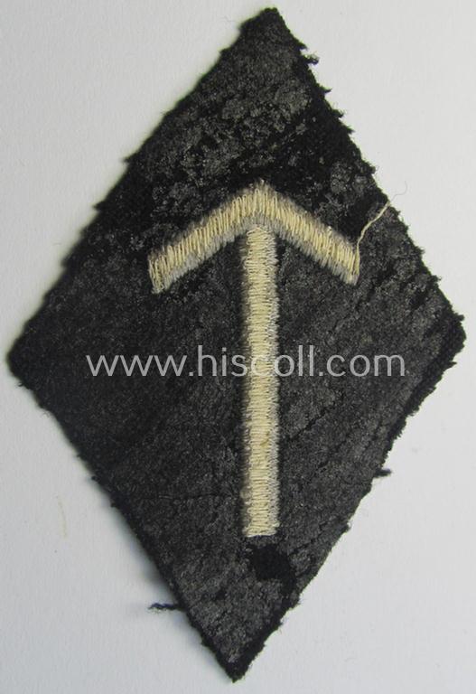 SS-pattern sleeve-insignia (ie. 'Ärmelraute') depicting a: 'Tyr'-rune signifying membership within the: 'Ergänzung, Erfassung u. Schulungswesen' within the: 'SS'