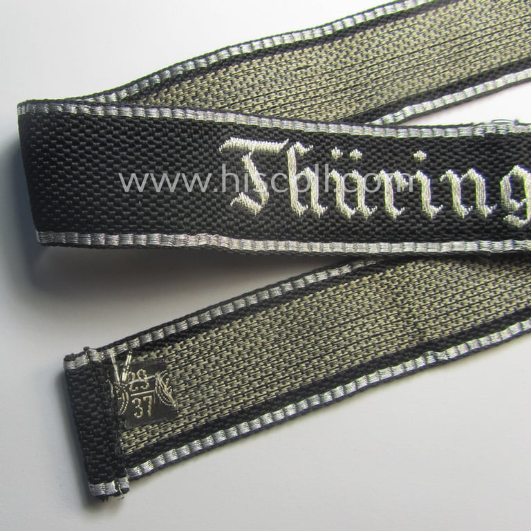 Stunning, 'SS-Totenkopfverbände'-officers'-type, 1937-pattern cuff-title (ie. 'Ärmelstreifen') as executed in flat-wire 'BeVo'-weave-pattern (in Gothic-styled script) for an officer within the: 'SS-Totenkopf Standarte' “Thüringen”