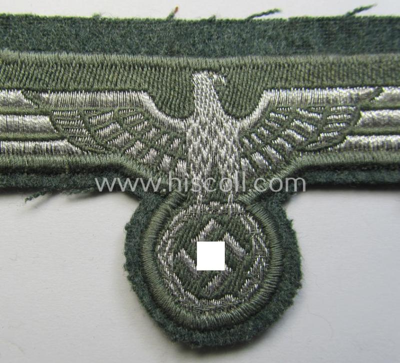 WH (Heeres) breast-eagle as executed in 'BeVo'-type-, so-called: 'flat-wire'-weave-pattern and pre-mounted on field-grey-coloured wool as was specifically intended for usage by soldiers (ie. NCOs) on their dress-tunics (ie. 'Waffenröcke')