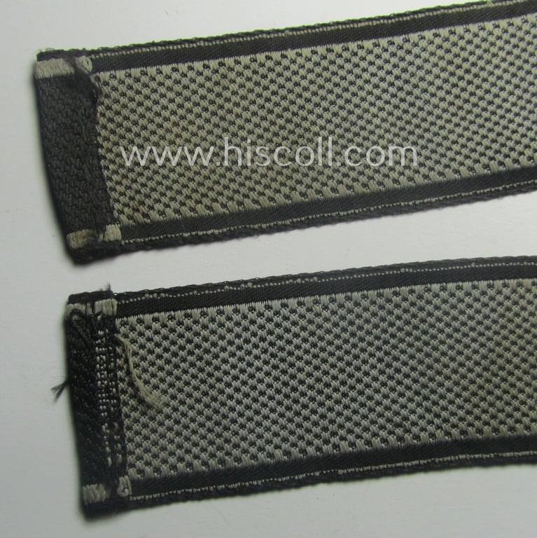 Waffen-SS, 1943-pattern cuff-title (ie. 'Ärmelstreifen') depicting the machine-woven Latin script text in silver-grey linnen as was intended for a member of the: 'SS-Geb.Jäg.-Rgts. 6. (u.11.)': "Reinhard Heydrich"
