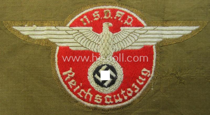 Superb - and rarely encountered! - breast-badge as executed in 'BeVo-weave' pattern as was intended for members within the 'N.S.D.A.P. Reichsautozug' (or: 'RaZ') still retaining its period, paper-based 'RzM'-etiket