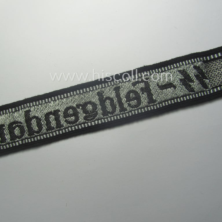 Superb - and truly rarely encountered! - example of a Waffen-SS, 'semi-BeVo'-pattern, EM- (ie. NCO-) type cuff-title (ie. 'Ärmelstreifen') as was intended for a member serving within the: 'SS-Feldgendarmerie'