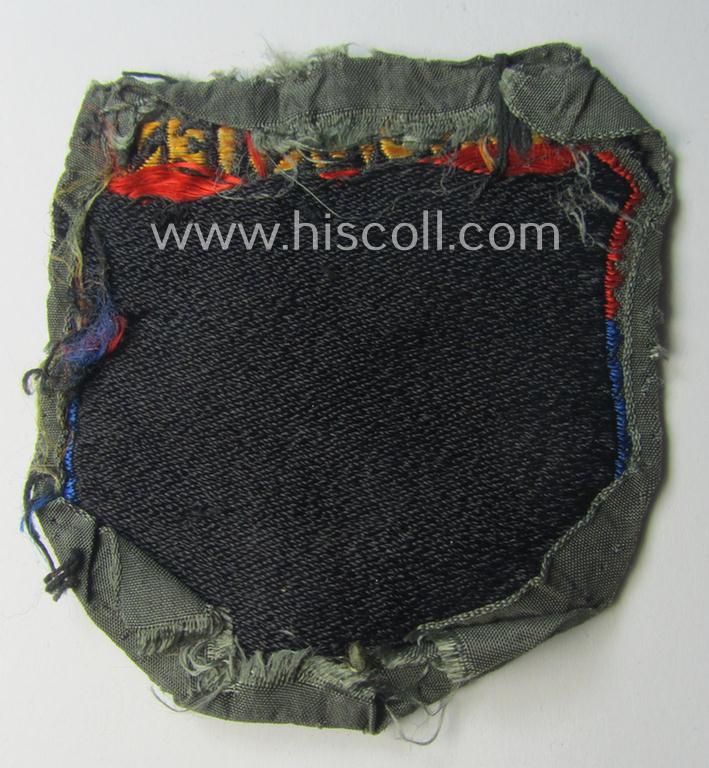 Truly used- and/or worn, multi-coloured- and/or 'BeVo'-woven armshield (ie. 'Ärmelschild') entitled: 'Armenien' as was intended for usage by a volunteer who served within the 'Deutsche Wehrmacht' ie. within the 'Armenisches Legion'