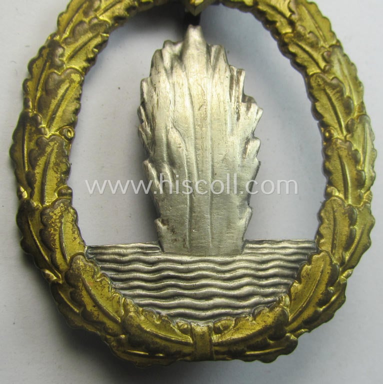 WH (Kriegsmarine) 'Kriegsabzeichen für Minensuch-, U-Boot-Jagd und Sicherungs-Verbände' (being a very detailed and clearly maker-marked example as executed in multi-coloured 'Buntmetall' as produced by the: 'Schwerin - Berlin'-company)