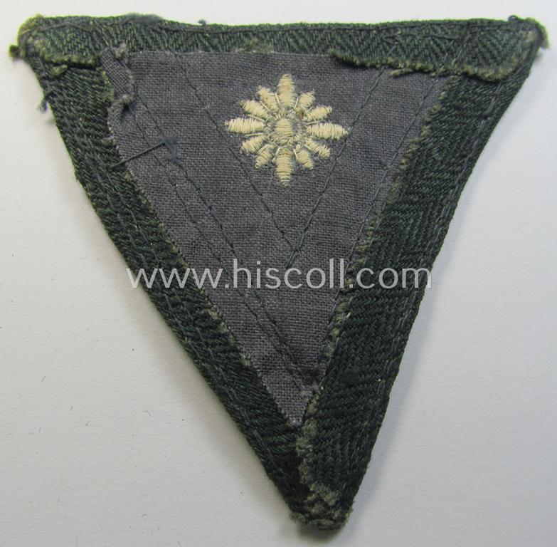 WH (Heeres) 'Armwinkel' (or: arm-chevron) as executed on typical field-grey-coloured wool as was specifically intended for usage by a soldier with the (unusually seen!) rank of: 'Stabsgefreiter'