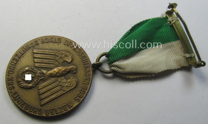 Superb - and most certainly unusually seen! - bright-golden-toned, TR-period shooting-medal that is entitled: 'Opferschiessen 1935 - Dtsch. Schützenbd. Krs. Lüneburg/Uelzen' that comes mounted onto its nicely preserved ribbon as issued