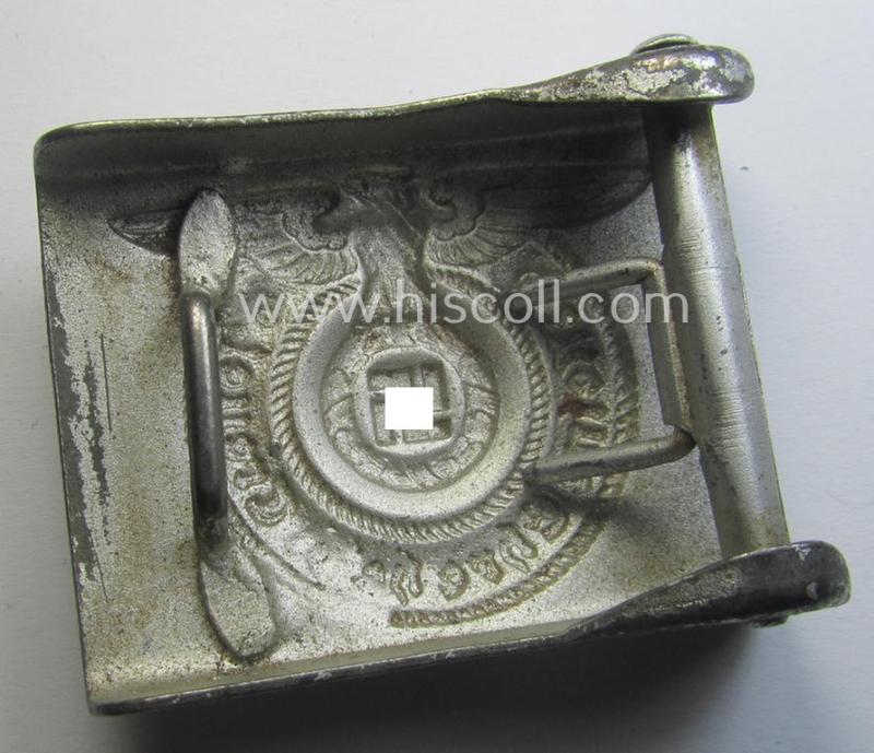 Waffen-SS, EM- (ie. NCO-) type belt-buckle (being a typical, unmarked and typical steel-based: 'Overhoff & Cie'-example) that comes in a surely issued- and/or moderately used- ie. worn, condition