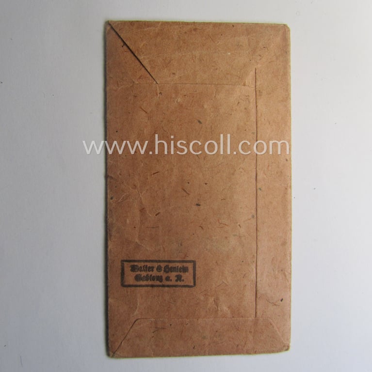 Empty 'Zellstoff'-based pouch as was intended for a medal: 'Winterschlacht im Osten 1941/42' as was produced by the company: 'Walter & Henlein - Gablonz a. N.'