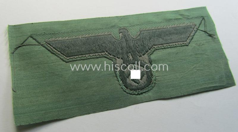 WH (Heeres) mid-war-period- and/or greyish-coloured breast-eagle of the so-called: 'M41'- (ie. 'M43'-) pattern 'Brustadler für Mannschaften u. Unteroffiziere') as executed in the neat 'BeVo'-weave pattern on a field-grey-coloured background