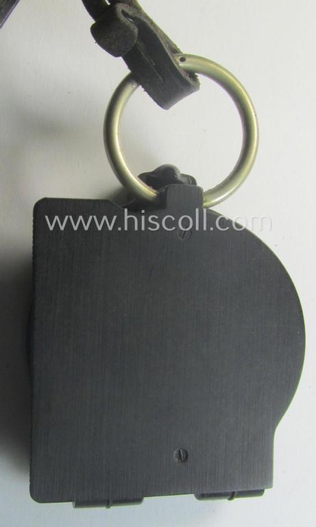 Pre-war-period, 'standard-issued'-pattern, black-coloured and resin-based WH compass (ie. 'Marschkompass') which is nicely maker- (ie. 'Busch - Rathenow'-) marked and that comes stored in its specific, leather-based etui