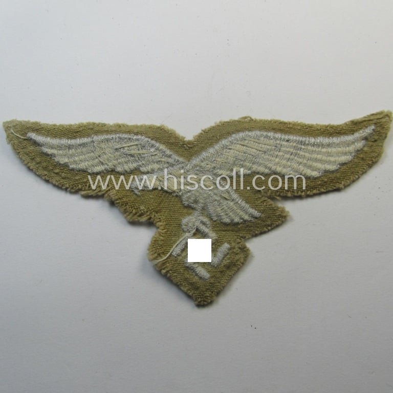 Moderately- ie. hardly used - and actually very scarcely found! - WH (Luftwaffe) 'tropical'-issued- (ie. DAK or 'Deutsches Afrika Korps'-related) EM- ie. NCO-type breasteagle as was specifically intended for usage on the tropical-tunics