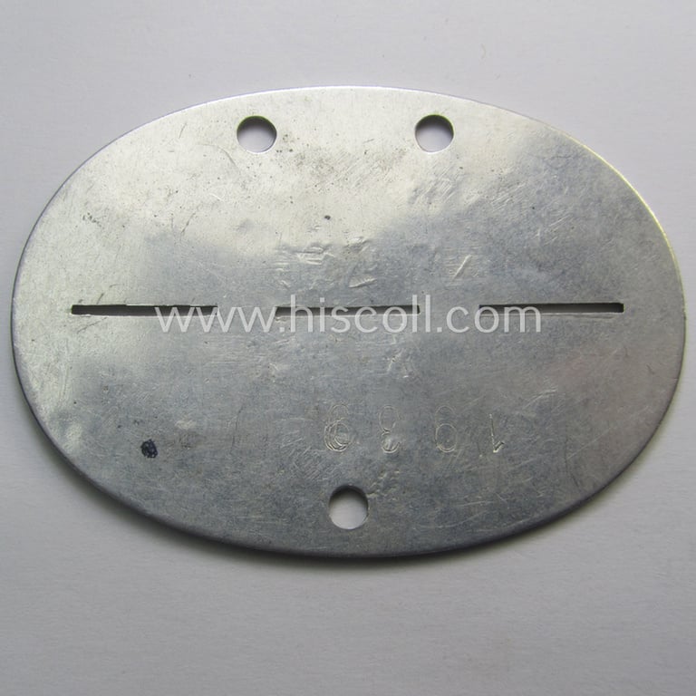 Attractive - and typical aluminium-based - WH (Luftwaffe ie. LW-Nachrichten) related ID-disc (ie. 'Erkennungsmarke') bearing the stamped unit-designation that simply reads: 'Ln.Komp. Böbl.' and that comes as issued and/or worn