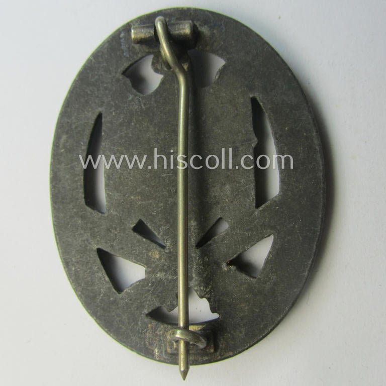 'Allgemeines Sturmabzeichen' (or: General Assault Badge ie. GAB) being a typical unmarked, zinc-based- (ie. 'Feinzink'-) and/or: 'flat-back'-version as was (I deem) produced by the: 'Rudolf Karneth'-company
