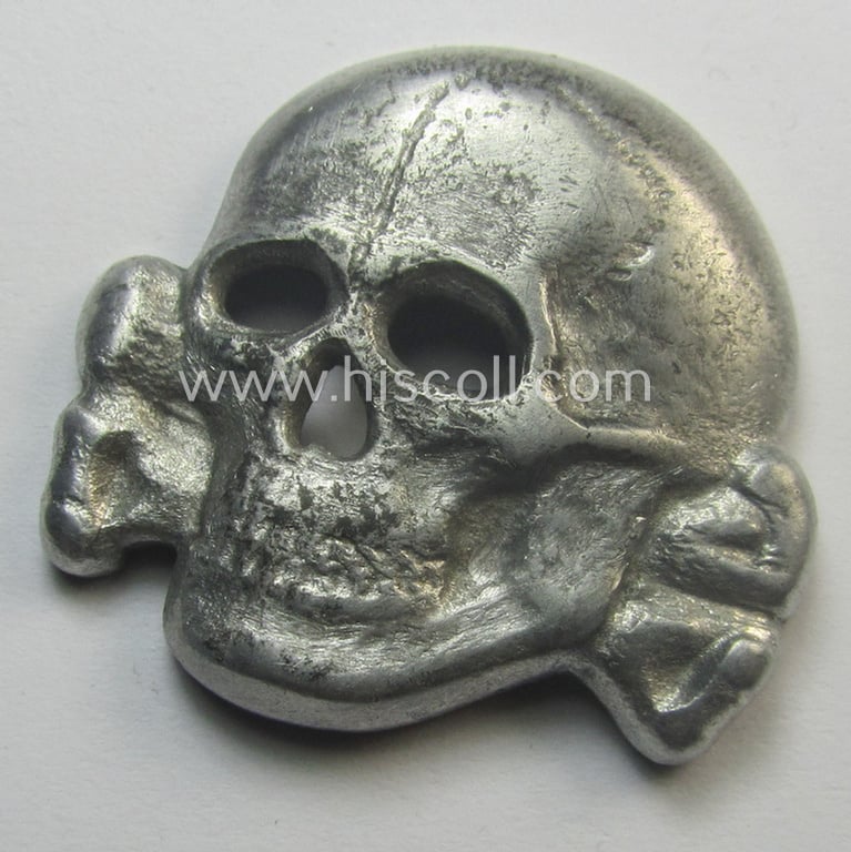Superb - albeit regrettably incomplete but nevertheless rarely encountered! - 'Waffen-SS' visor-cap skull (ie. 'Totenkopf für Schirmmütze') being a detailed- and/or maker- (ie. 'RzM 499/41'-) marked example