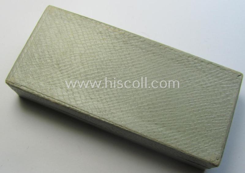 Light-weight (ie. typical aluminium-based) medal as was intended for air-raid wardens 2nd. class (or: 'Luftschutz-Ehrenzeichen 2. Stufe') that comes stored in its period, dove-grey-coloured etui