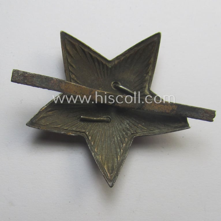 Unusual item that originated from a German soldier: a Russian, larger-sized and/or WWII-period, enamelled star-shaped cap-badge showing the communist logo on a bright-red-coloured surface