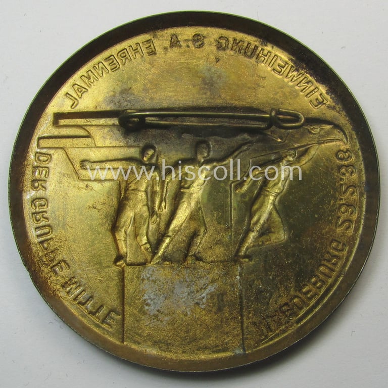 Commemorative, SA- (ie. 'Sturmabteilungen'-) related 'tinnie' being a non-maker-marked example showing three sportsmen and eagle-statue coupled with the text: 'Einweihung S.A.-Ehrenmal der Gruppe Mitte - Magdeburg - 23.2.1936'