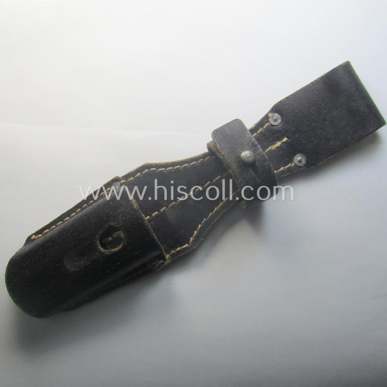 Genuine-leather-based- and/or black-coloured, 'standard-pattern' (and I deem later-war-period) WH (Heeres, Waffen-SS, Luftwaffe etc.) so-called: K98 bayonet-frog (ie. 'Tragetasche o. Koppelschuh') being a maker-marked (ie. 'RbN.'-numbered) exam...