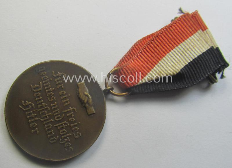 Darker-bronze-toned commemorative-medal (ie. 'Erinnerungs-Medaille') entitled: 'Hindenburg - Hitler - 30.1.1933 - 5.3.1933' and that comes mounted onto its period ribbon showing an interwoven swastika-device