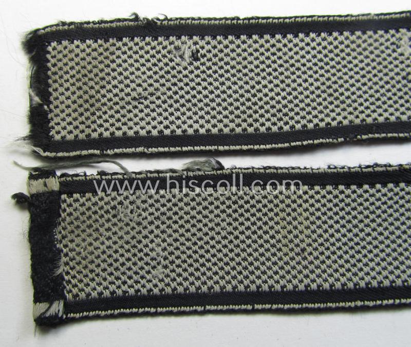 Stunning - and truly worn! - Waffen-SS 1943/44 pattern cuff-title (ie. 'Ärmelstreifen') depicting the machine-woven Latin script text in silver-grey-coloured linnen as was  intended for a member within the: 10. SS-Panzer-Division 'Frundsberg'