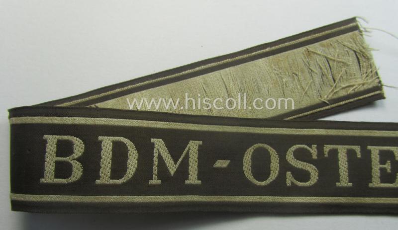 Superb - and actually rarely encountered! - example of the HJ/BDM- ('Hitlerjugend' ie. 'Bund Deutscher Mädel'-) cuff-title (ie. 'Ärmelstreifen') entitled: 'BDM-Osteinsatz' being an example as executed in the neat 'BeVo'-weave pattern