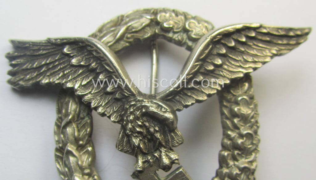Early- (ie. pre-) war-period- and/or: 'Buntmetall'- (ie. 'Tombak'-) based: WH (Luftwaffe) 'Flugzeugführerabzeichen' (or: pilots-badge) being a maker- (ie. 'C.E. Juncker'-) marked example of the 'J3'-pattern