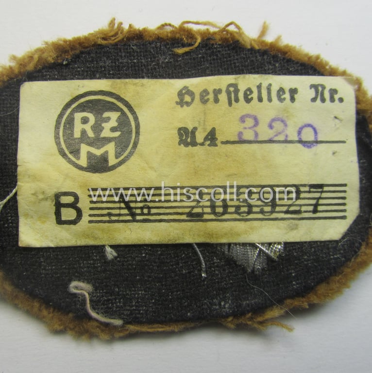 Attractive - and rarely encountered! - hand-embroidred, SA- (ie. 'Sturmabteilungen'-) related officers'-type armbadge (ie. 'Ärmelabzeichen für Führer') as was intended for an: 'SA-Führer' (ie. 'Feldscher o. Arzt') that retains its period 'RzM'-etiket