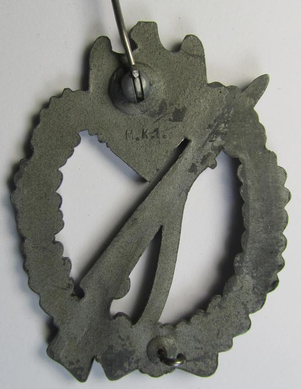 Attractive - and moderately used! - 'Infanterie-Sturmabzeichen in Silber' (or: silver-class infantry-assault badge ie. IAB) being a neatly maker- (ie. 'MK 1'- or: 'Metall u. Kunststoff'-) marked example as executed in silverish-coloured 'Feinz...