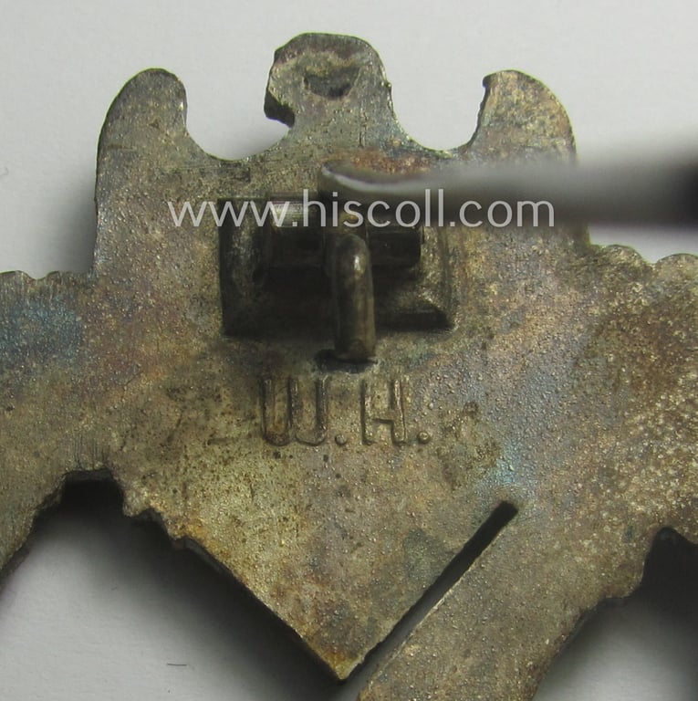'Infanterie Sturmabzeichen in Silber' being a maker- (ie. 'W.H.'-) marked and/or quite converse, 'solid-back' example by the Austrian-based maker: 'Wilhelm Hobacher' as was executed in bright silver-coloured, zinc-based metal