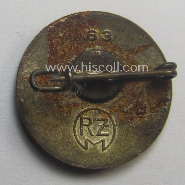 Neatly enamelled- (and bright-red-coloured!) 'variant-pattern', 'N.S.D.A.P.'-membership-pin- ie. party-badge (or: 'Parteiabzeichen') which is nicely maker-marked on the back with the makers'-designation: 'RzM' and/or: '63'