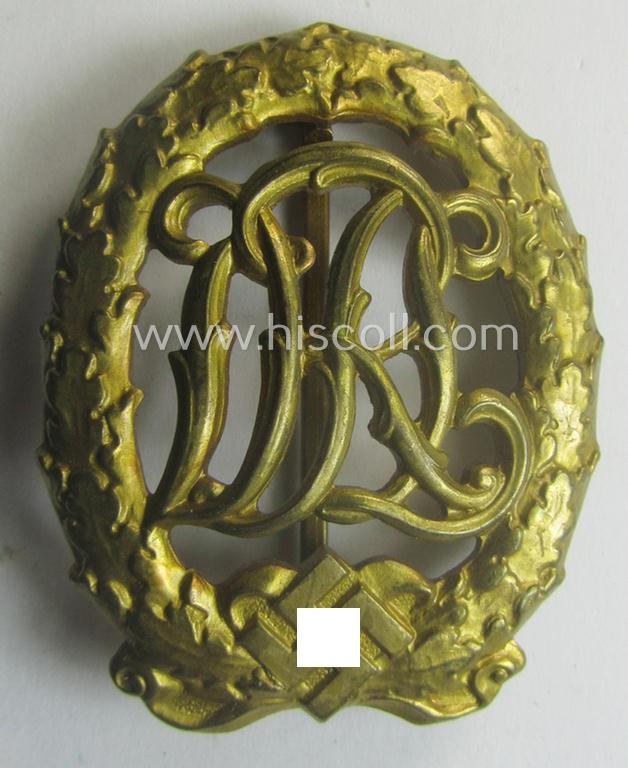 'Reichssportabzeichen DRL in Gold' (or: golden-class DRL sports'-badge) being a truly detailed and/or: maker- (ie. 'Wernstein - Jena'-) marked example that comes stored in its (rare!) period carton-based box