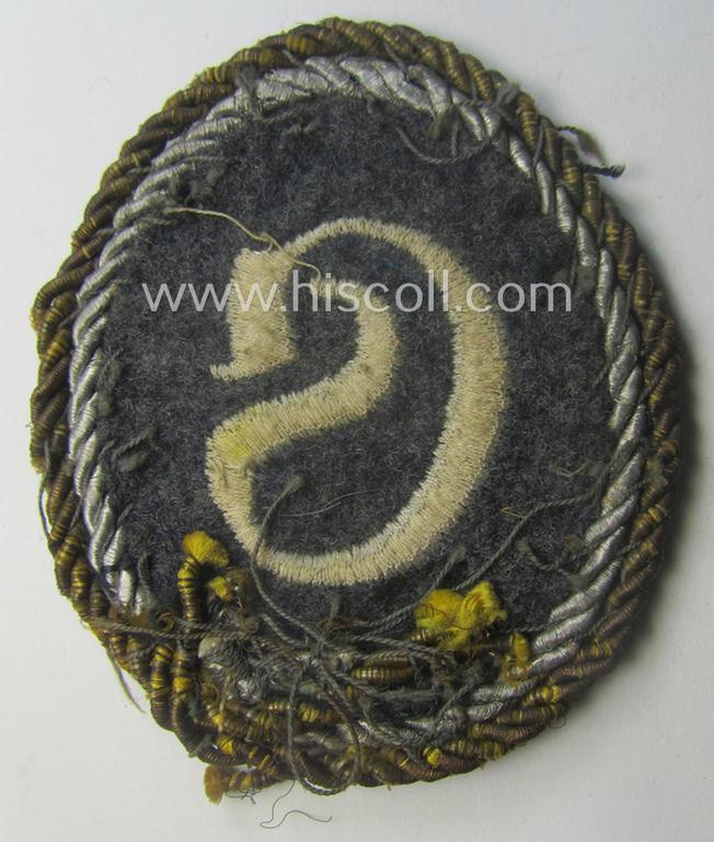 WH (Luftwaffe) machine-embroidered, trade- ie. special-career-patch (ie. 'Tätigkeitsabzeichen') having a golden-coloured 'Goldkordel' attached as was intended for: 'geprüfter Schirrmeister' (ie. senior equipment-administration staff)