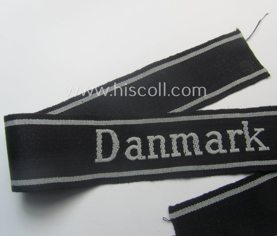 Stunning, Waffen-SS 1944-pattern cuff-title (ie. 'Ärmelstreifen') as executed in typical semi-'BeVo'-weave-pattern as was intended for members within the: 'SS-Panzer-Gren.-Rgt. 24' “Danmark” (part of the 11. SS-Frw.-Pz.-Gren.-Division “Nordland”)