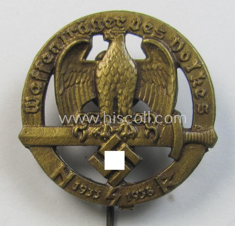 Superb - and rarely found! - Austrian-related, golden-bronze-toned: 'Nationalsozialistischer Soldatenring'- (ie. NSR-) lapel-pin (ie. 'Mitgliedsabzeichen') depicting an eagle-device and text: 'Waffenträger des Volkes 1933-1938'