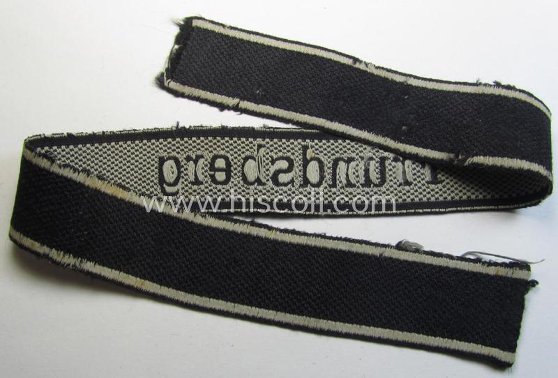 Stunning - and truly worn! - Waffen-SS 1943/44 pattern cuff-title (ie. 'Ärmelstreifen') depicting the machine-woven Latin script text in silver-grey-coloured linnen as was  intended for a member within the: 10. SS-Panzer-Division 'Frundsberg'