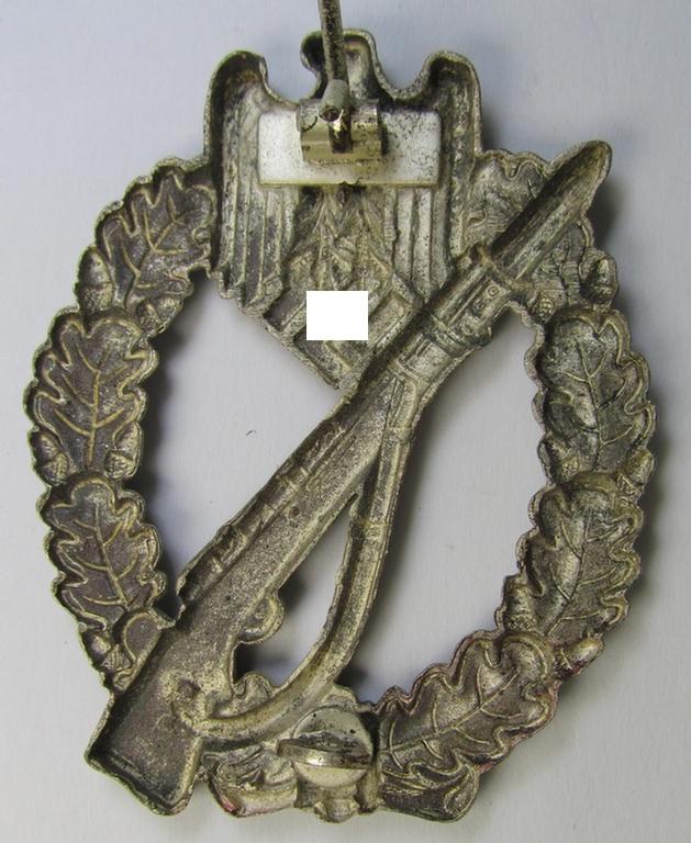 Attractive, 'hollow-back'-pattern 'Infanterie Sturmabzeichen in Silber' (or: silver infantry-assault badge ie. IAB) being a non-maker-marked example as executed in zinc-based metal (ie. 'Feinzink') as was produced by the: 'Wilh. Deumer'-compa...