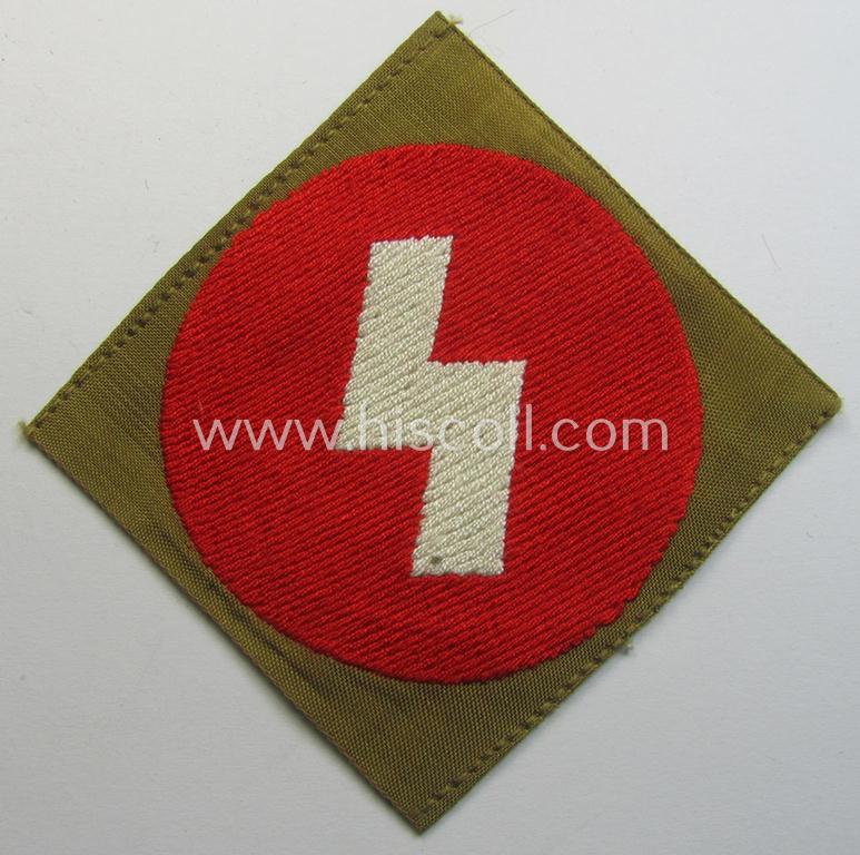 Attractive, DJ (ie. 'Deutsches Jungvolk') arm-badge as was intended for usage by a member who served within the: 'Oberbann 1' (being a 'virtually mint- ie. unissued' example that still shows its period-attached, 'RzM'-etiket)